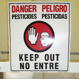 Photo of a pesticide warning sign. Photo by Cecil Tharp.