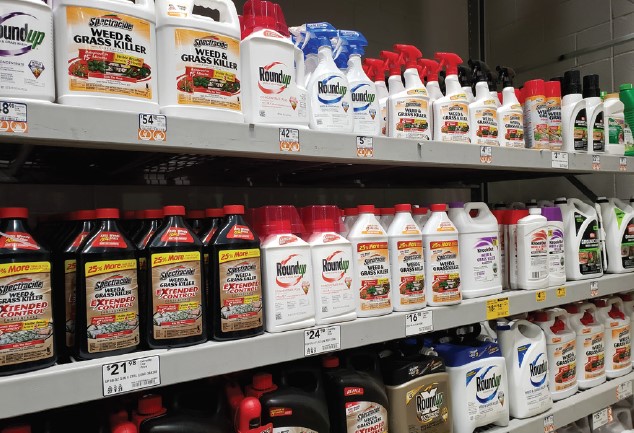 Many varieties of herbicides on a store shelf