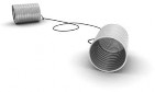 An image of two steel cans connected by a string