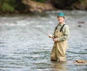 A man fishing in a river