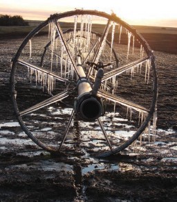 A frost covered irrigation wheel in the field